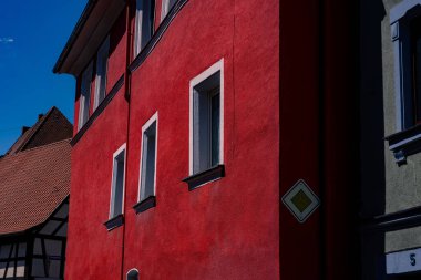 A closeup shot of a red facade of a building