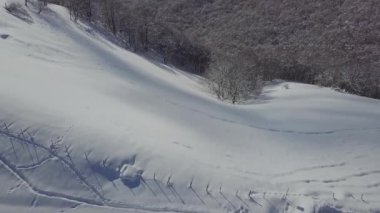 An aerial view of the snowy mountain Monte Generoso in Ticino, Switzerland