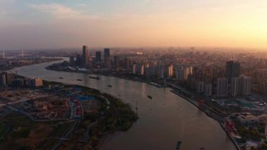A drone view of Huangpu River in Shanghai, China during sunset