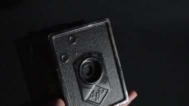 A close-up of a vintage photo camera, Agfa Box 44 in slow motion,