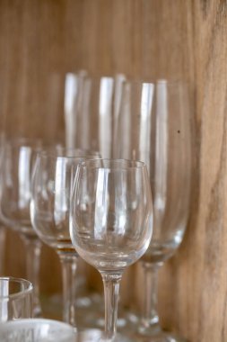 The empty clean wine and champagne glasses on the shelf