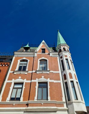 A house facade with a pointed tower in the city center of Eckernfoerde