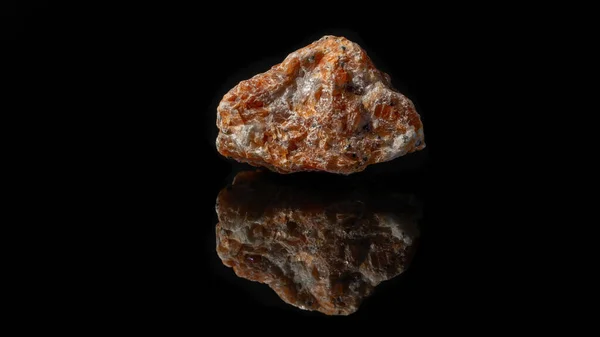 Closeup Uncut Raw Orange Red Calcite Pebble Reflective Black Surface — Stock Photo, Image