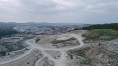 An aerial view of road on rocky mountains