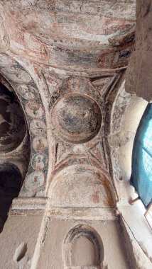 A vertical shot of an ancient ceiling of a building