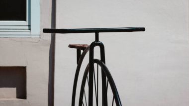 A closeup shot of a vintage bicycle sculpture near a museum in Vrsac, Serbia