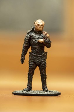 A selective focus shot of an orc figurine from the Lord of the Rings movie