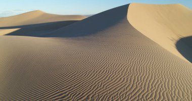A drone view of the Glamis Sand Dunes in Imperial County, California, USA clipart