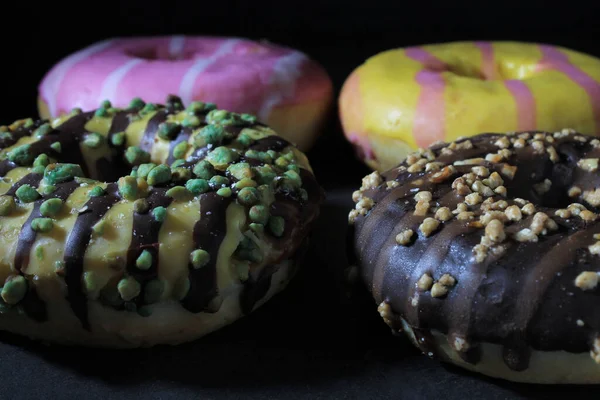 Closeup Several Colorful Donuts Table Dark Background — Stock Photo, Image