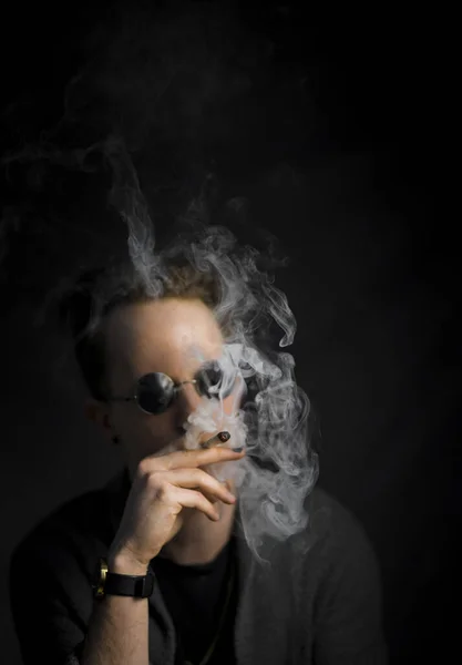 Vertical Shot Smoking Young Guy Wearing Black Sunglasses Isolated Black — Stok Foto