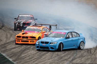 Bmw 3 Series E90 drifting on the circuit clipart