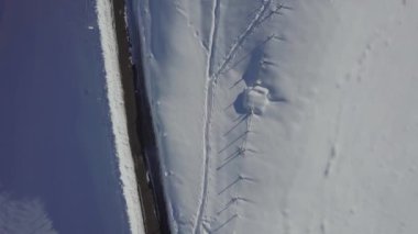 An aerial view of the snowy mountain Monte Generoso in Ticino, Switzerland
