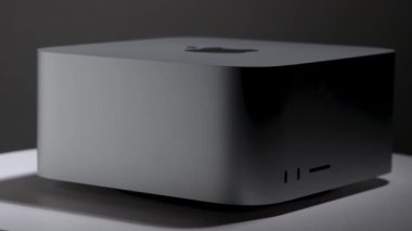 Product still life of Mac Studio Apple desktop computer in contrasting monochrome tones with studio lighting and harsh shadow