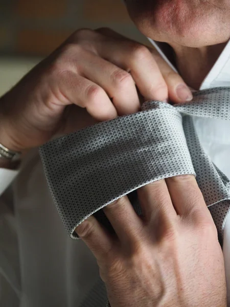 Closeup Elegant Male Adjusting His Stylish Gray Tie — Stock Photo, Image