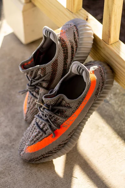 Closeup Adidas Yeezy Boost 350 Shoes Leaning Wooden Fence — Stock Photo, Image