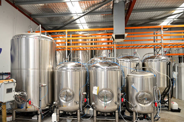 A closeup of Beer vats in a room