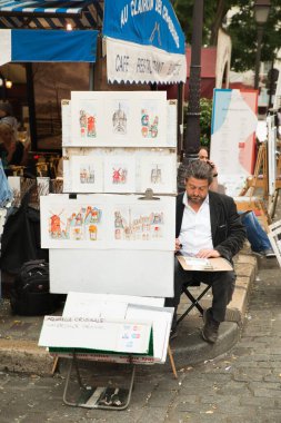 Montmartre Paris, Fransa 'nın turizm merkezi, portre çizen sanatçılar.