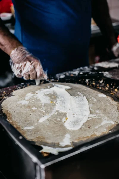 Closeup Shot Adult Male Hands Cooking Crepe Kitchen Blurred Background — Stock Photo, Image