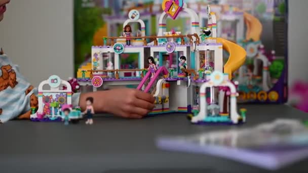 Little Child Pajama Playing Colorful Lego Toys — Stock Video
