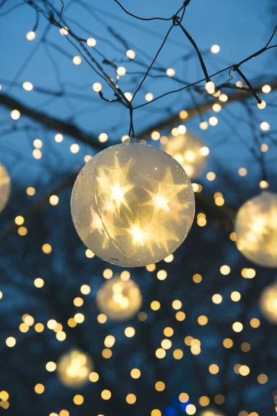 Vertical Closeup Shot Christmas Tree Ball Yellow Shining Stars Hanging — Stock Photo, Image