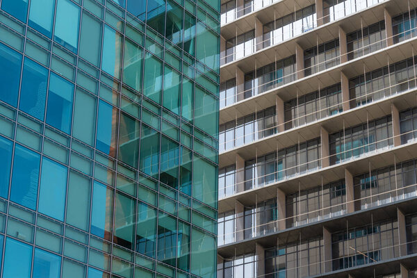 The abstract detail of modern architecture and the different colors of two buildings