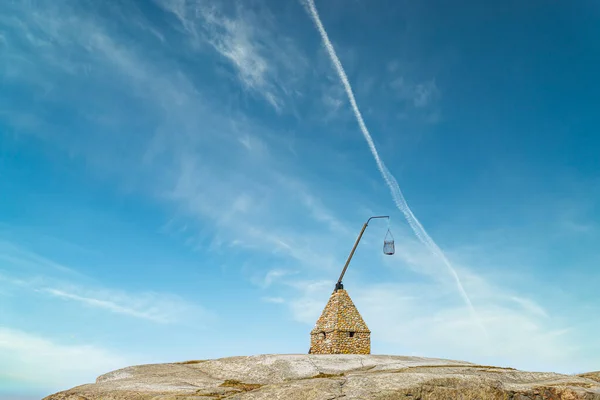 Old Stone lighthouse (Vippefyr) at Worlds End Norway, popular tourist destination