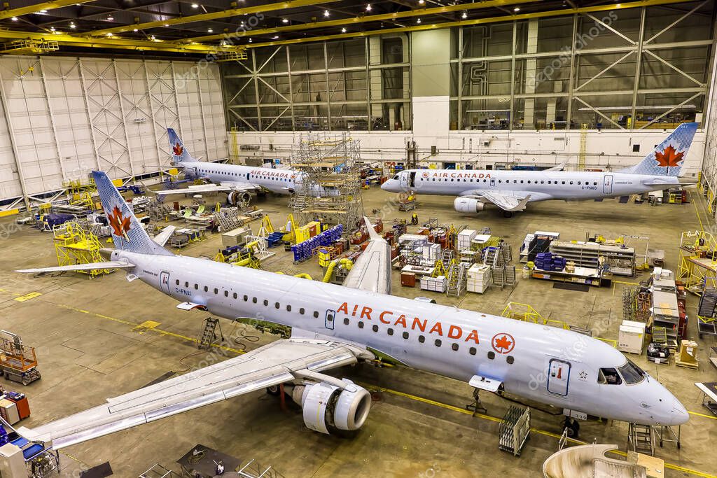 The inside of a maintenance hangar with aircraft belonging to Air Canada
