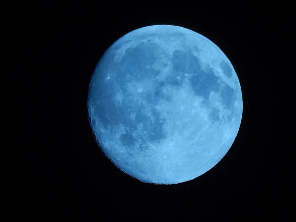A beautiful view of the blue moon in a dark sky