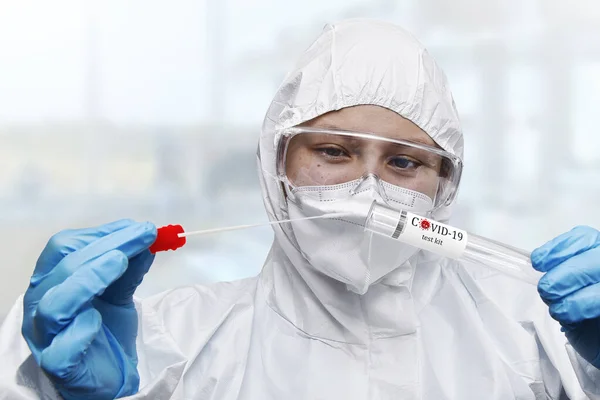 Nhs Technician Holding Covid Swab Collection Kit Wearing White Ppe — Stock Photo, Image