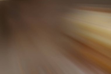 Açık kahverengi bulanık tonlarda parıldayan bir yıldız patlaması