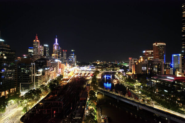 An aerial view of the illuminated modern buildings in the downtown at night