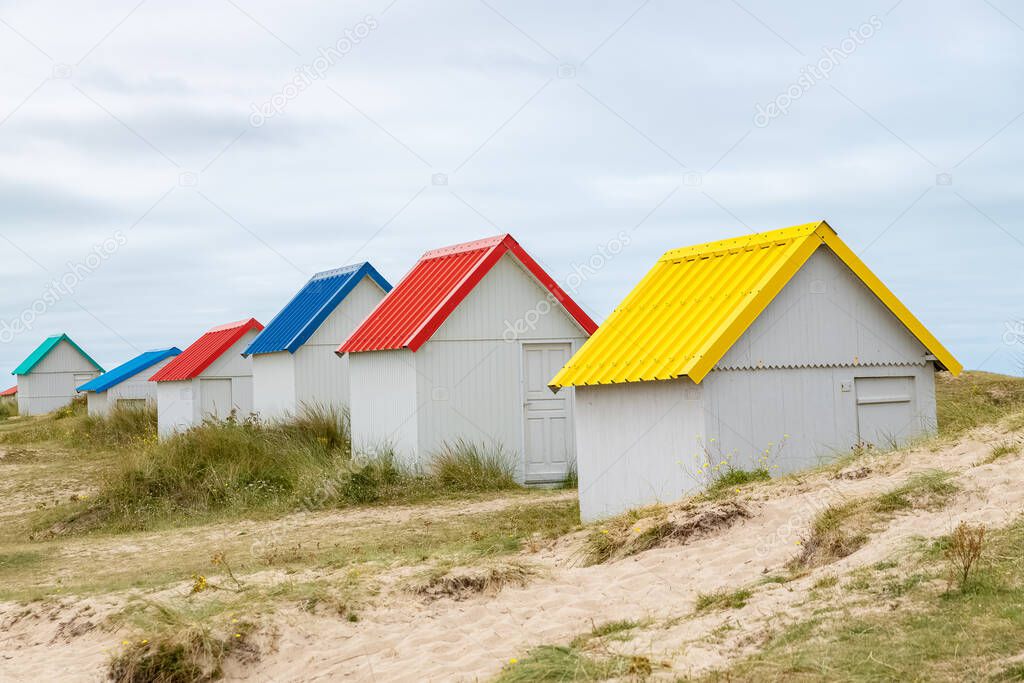 Gouville-sur-Mer, Normandy, colorful wooden beach cabins in the dunes