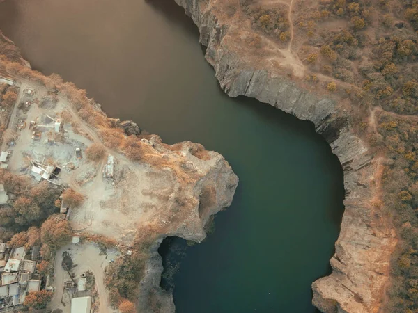 A drone footage of a huge canyons and teal turbid quiet waters