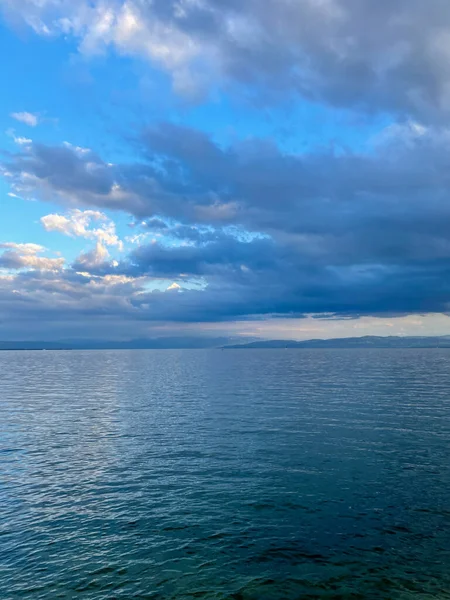 A vertical shot of the Lake Constance under the cloudy skies