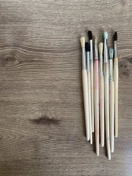 Set Different Paint Brushes Wooden Table — Stock Photo, Image