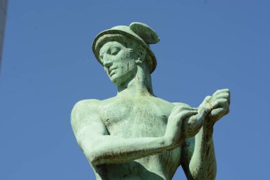 Sculpture of the ancient greek god Hermes, also known as the Roman god Mercury, the God of trade, merchants, Shepherds and travelers. clipart