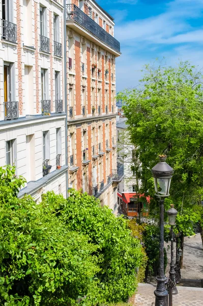 Paris, romantic staircase in Montmartre, typical buildings and floor lamp