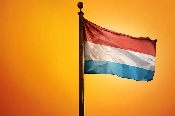 National Flag Luxembourg Flagpole Isolated Orange Background — Stock Photo, Image