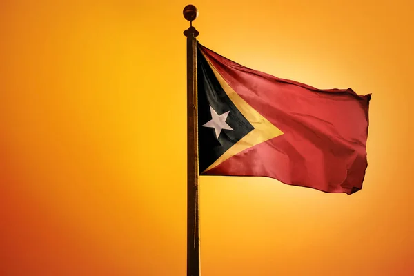 Representación Bandera Timor Oriental Ondeando Viento Con Fondo Naranja —  Fotos de Stock