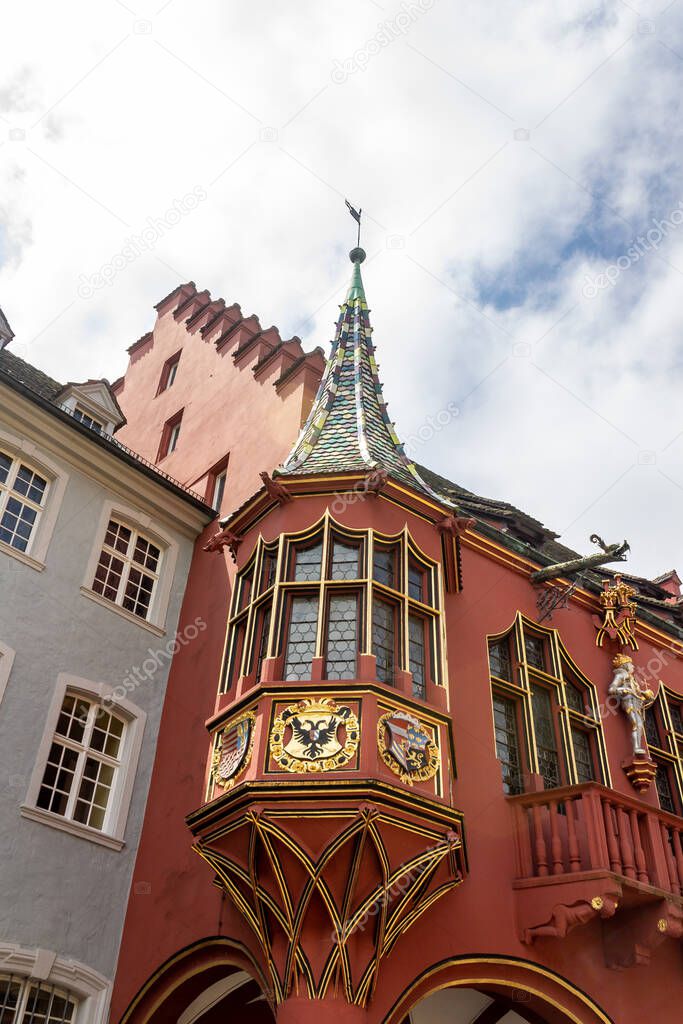 A vertical shot of historical merchants hall in Munsterplatz, downtown Freiburg, Germany, Europe