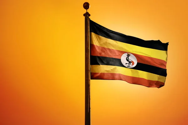 Representación Una Bandera Ondeante Uganda Sobre Poste Sobre Fondo Naranja — Foto de Stock