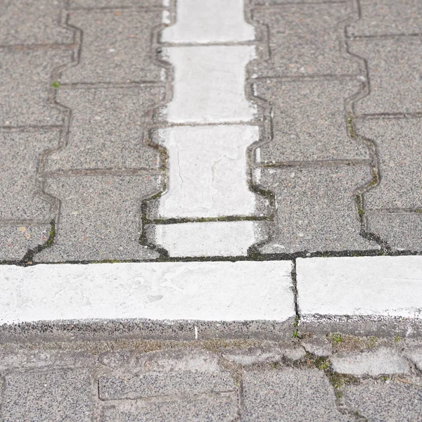 Eine Nahaufnahme Der Bemalten Linien Auf Den Pflasterplatten — Stockfoto