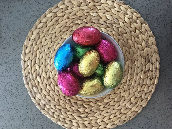 Colourful Foil Wrapped Chocolate Easter Eggs Bowl Straw Wicker Woven — Stock Photo, Image