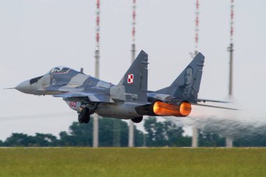 Polish Air Force Mig 29 fighter jet from Poland taking off with full afterburner to a mission clipart