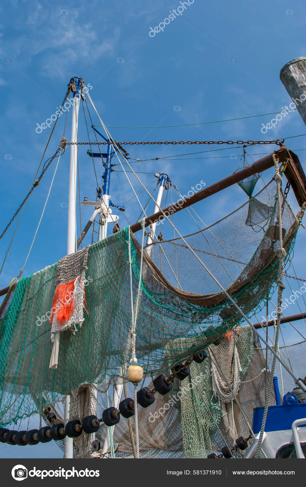 Low Angle Shot Nets Hanging Trawlers Fishing Vessel Stock Photo by  ©wirestock_creators 581371910