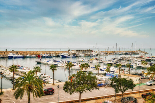 The harbor of Villajoyosa, Spain against a blue sky