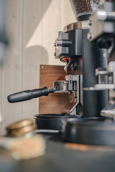A vertical shot of a coffee machine in a coffeeshop cafe