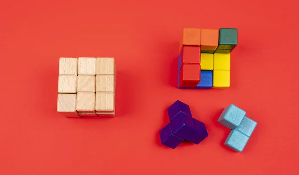 Closeup Shot Colored Wooden Puzzle Blocks Isolated Red Background — Stock Photo, Image