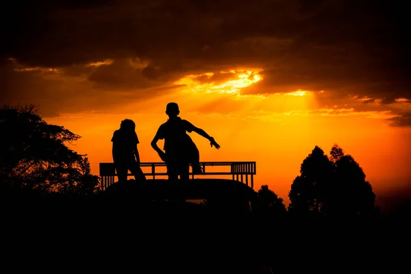Beautiful Silhouette Shot Children Dancing Car Roof Sunset Golden Sky — Stock Photo, Image