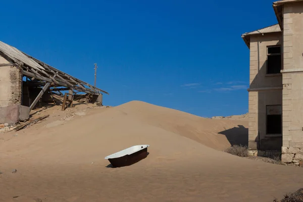A shot of abandoned buildings in the desert in Kolmanskop Ghost Town Namibia